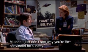 Mulder and Scully debating, with caption, "Mulder, I just don't see why you're so convinced he's 'natty.'"