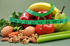 stock phot of healthy foods and tape measure