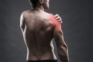 Man experiencing shoulder impingement pain